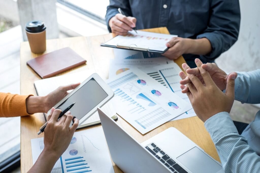 business team meeting working analyzing with financial data and marketing business strategy project e1669254582711 1